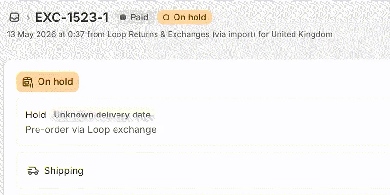 A Shopify order named EXC-1523-1, badged paid and on hold and recorded as coming from Loop Returns and Exchanges, its fulfilment card held against an unknown delivery date with the hold reason reading pre-order via Loop exchange.