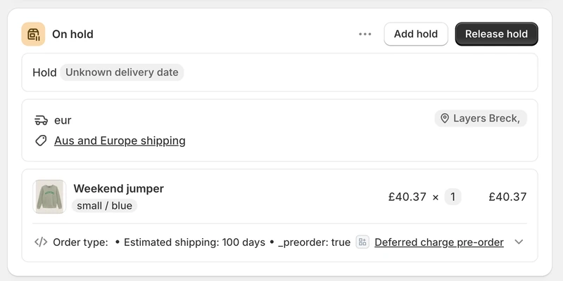 A Shopify order's fulfilment card badged On hold with Add hold and Release hold controls, the hold reason reading unknown delivery date, above the pre-order line item and its estimated shipping and _preorder properties.
