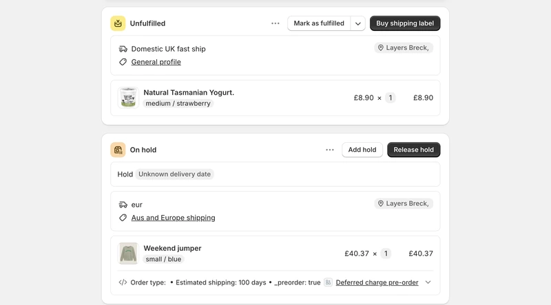 Two fulfilment cards from one Shopify order, the in-stock yogurt line badged Unfulfilled with Buy shipping label ready, the pre-order jumper line badged On hold against an unknown delivery date with its _preorder property beneath.